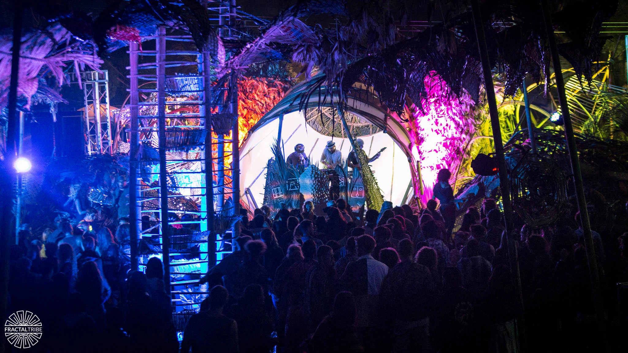 Agents of Vibe — crowd and lit jungle canopy